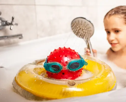 girl in bath with water heated by a tankless water heater