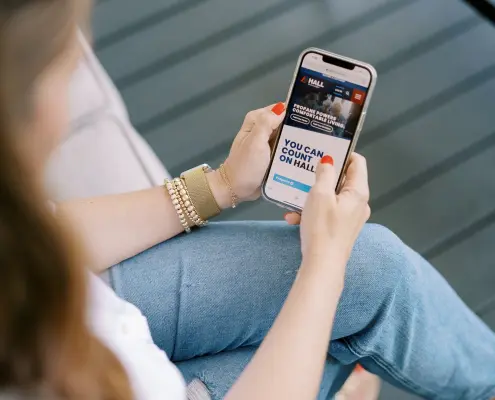 Hall_web-042 Image of customer using mobile phone to access HallPropane.com