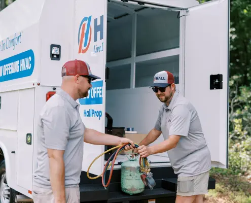 two HVAC service technicians responding to a service call