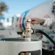 Hall technician refills propane tank