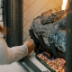Residential Hall customer lighting a propane gas fireplace