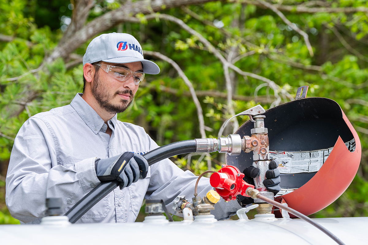 Hall technician filling a residential propane tank