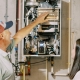 Hall technician explaining how a tankless water heater works to a customer