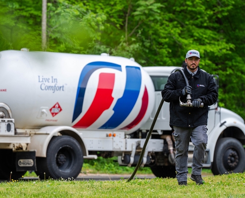 Propane tech making a delivery