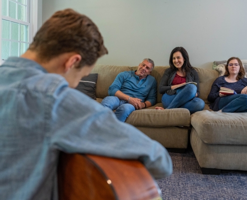 Family on a couch in their living room