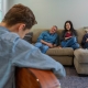 Family on a couch in their living room