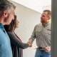 air conditioning expert shaking customers hand