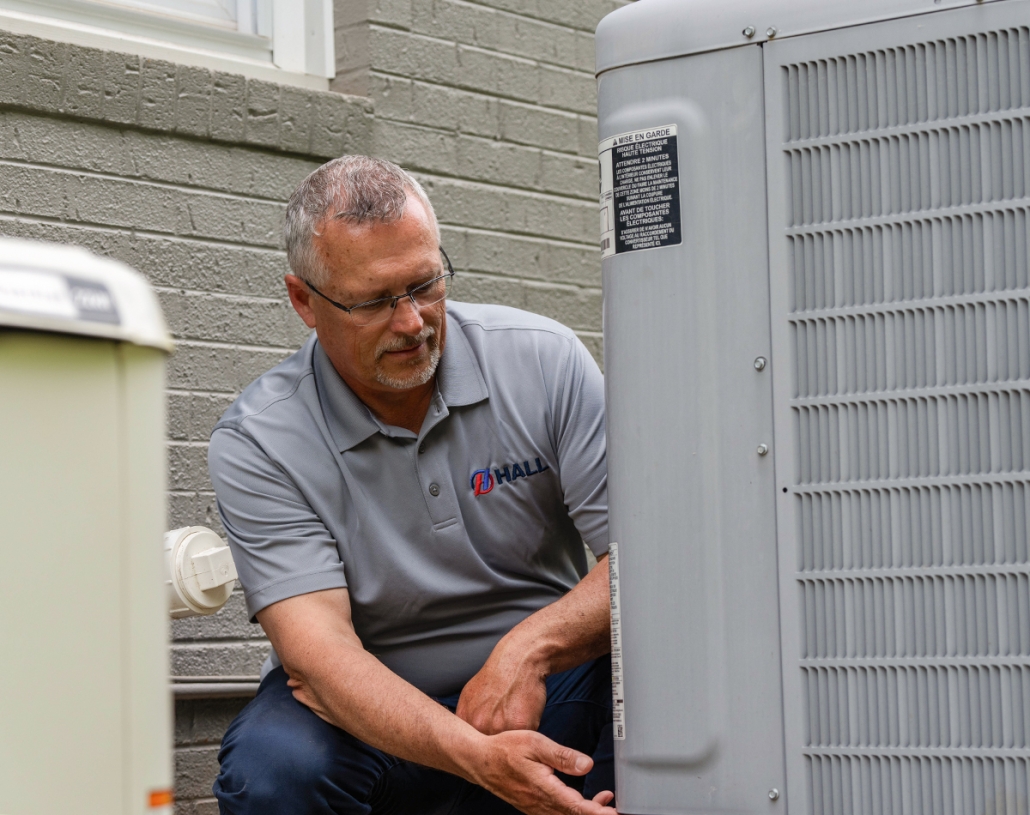 DSC04055 Hall HVAC technician working on an outdoor unit